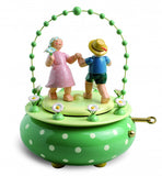 5336/52A Wendt & Kuehn Music Box Two dancers in the Garden  with 36 tone Music Work  Height 7.5 " with minor paint chips on boy and girl arms as well as green wreath balls and paint cracks in - German Specialty Imports llc